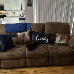 Reclining couch and loveseat with free coffee table and two end tables