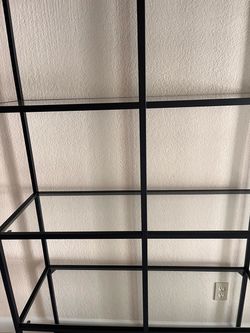 Storage Shelves. Black with glasses.