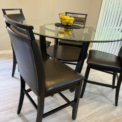 Black Glass top table with 4 faux leather chairs