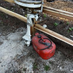 Old Boat Motor And Metal Gas Can