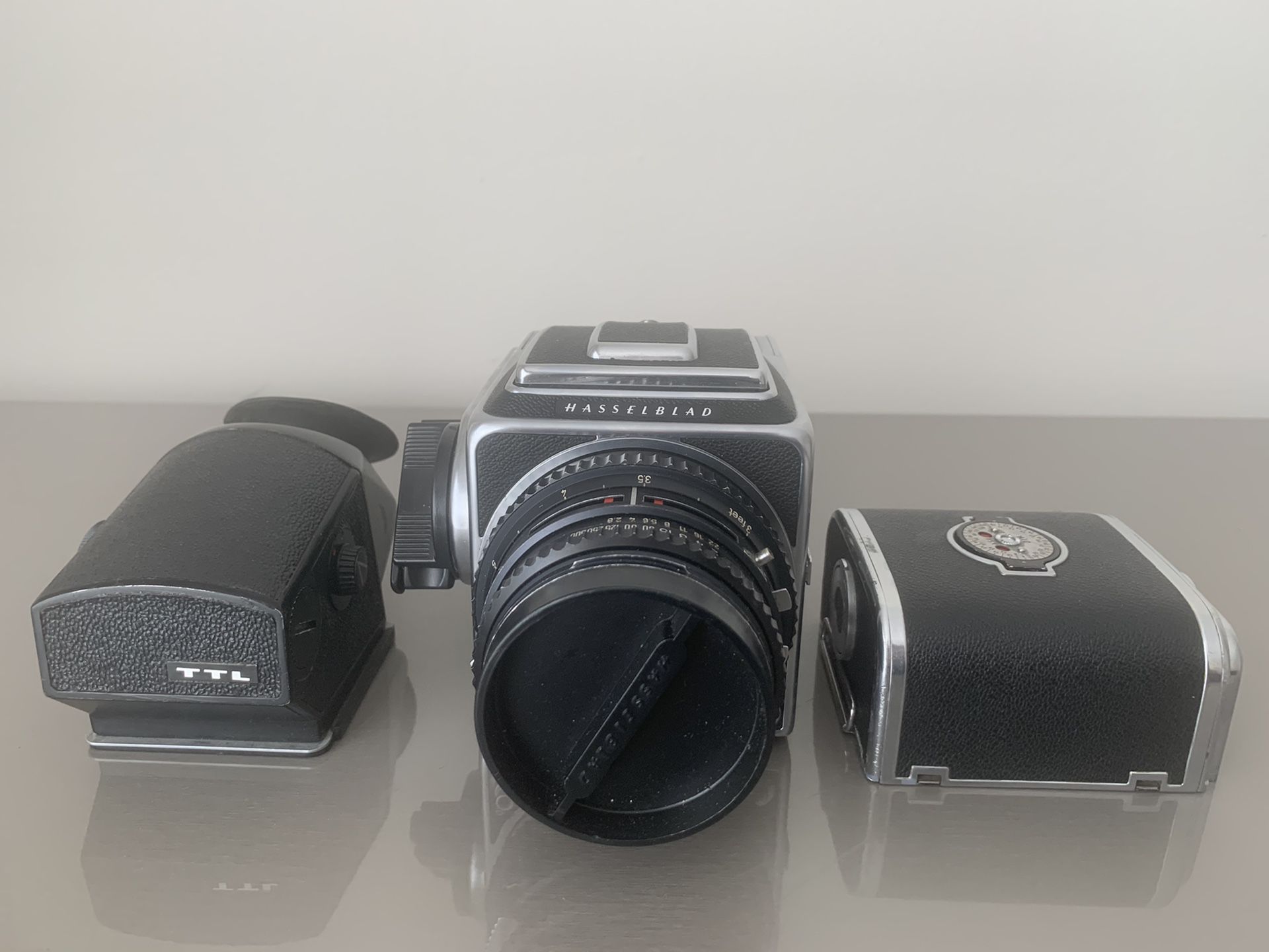 Hasselblad 500CM with 80mm lens, two backs, and TTL meter