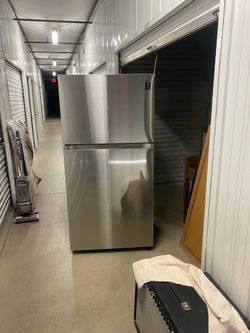 Samsung stainless steel refrigerator, top freezer, model RT21