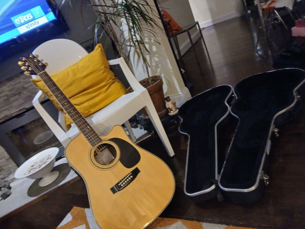 Takamine Accustic Electric Guitar Model Number EG-334SC.  Also Hard Cover Case By Freedom By skb