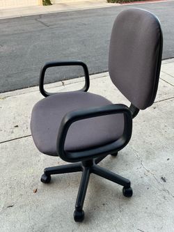 Basic office or student desk chair with wheels. Everything works.