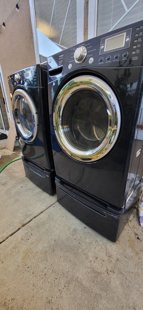 LG washer and gas dryer with pedestals