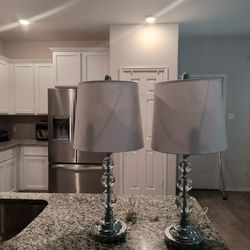 Two Silver And White Lamps (25' H)