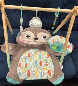 Otter Tummy time mat w wooden arc toys baby mirror & pillow
