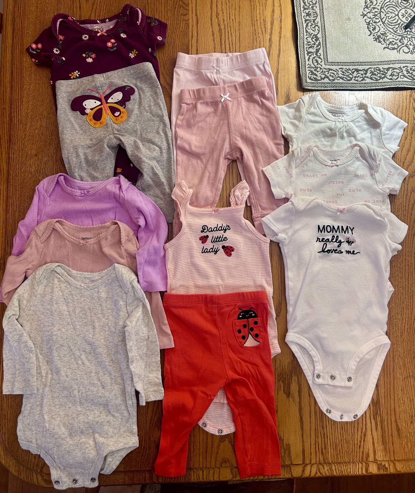 Lot of 12 - Girls 6mt Carter’s Pieces - 3 long sleeve onesies, 2 outfits (onesie and matching pants), 2 pairs of pants, 3 short sleeve onesies