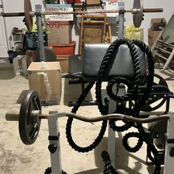 Weight Bench, Curl bar, Curl Machine, And Weights