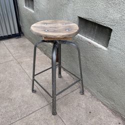 Vintage stool with sturdy metal base and solid wood top. Recently repaired. Very solid patina.  28 inches high. Original vintage industrial antique st