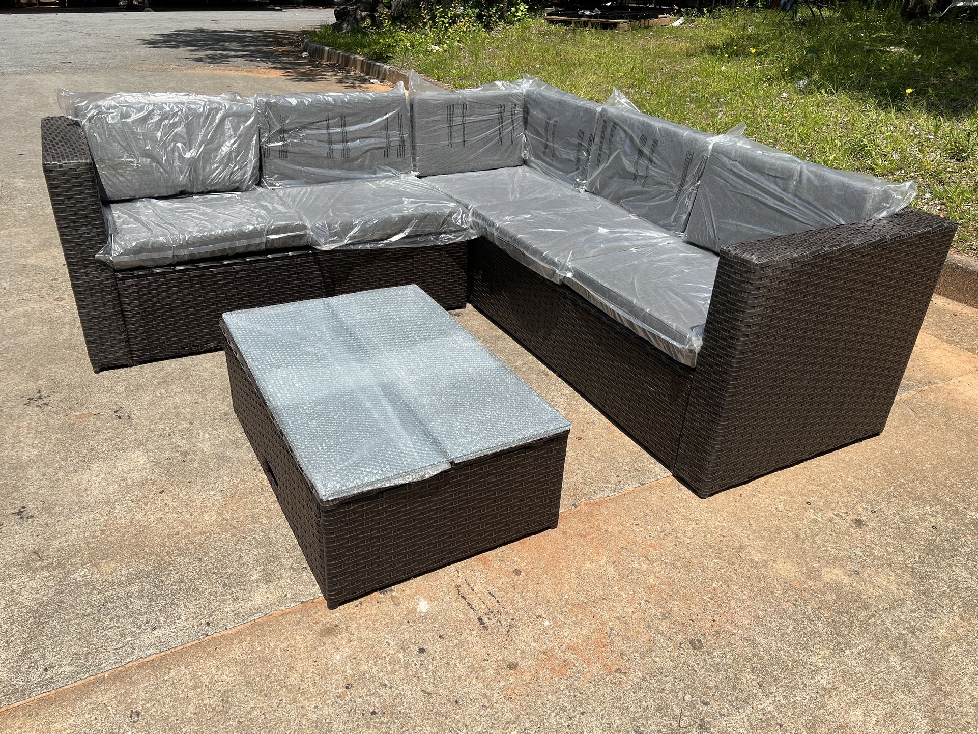 New 4-Piece Outdoor Furniture Set All-Weather Brown Wicker Sectional Sofa w Warm Gray Thick Cushions, Glass Coffee Table