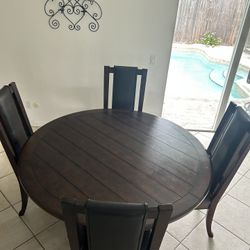 Round dining Table 60” And 4 Chairs  (Ashley )