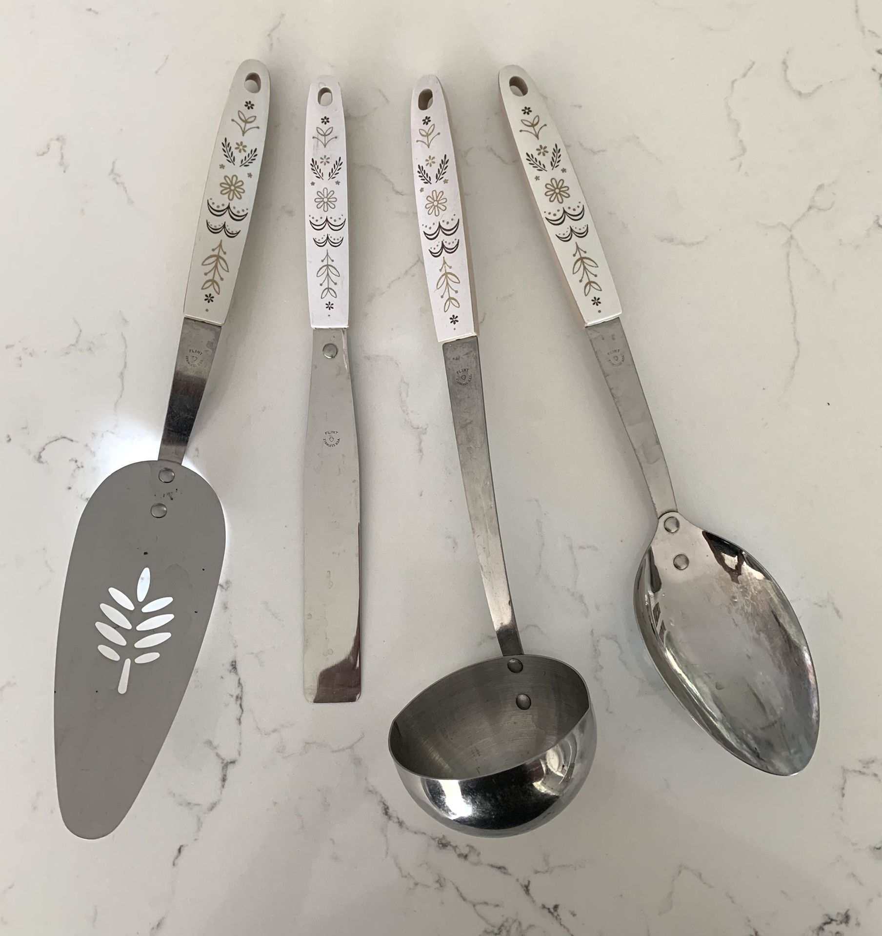 Set of 4 vintage Flint USA stainless steel utensils. Includes large spoon, ladle, flat spatula and a larger spatula. Nice condition.