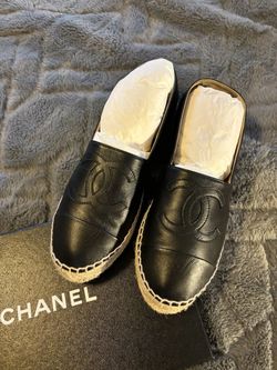 Chanel black lambskin leather espadrilles .