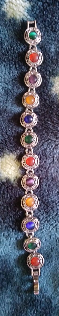 Metal cats eye glass gem bracelet nice!