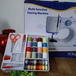 Small sewing machine wth accessories.