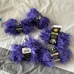 Five beautiful new balls of fun fur purple yarn