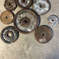 75LBS of Various Iron Weight Plates, One Straight Bar, Two Dumbbell Bars.