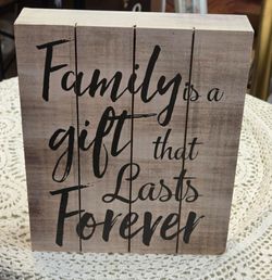 At home plaque with saying