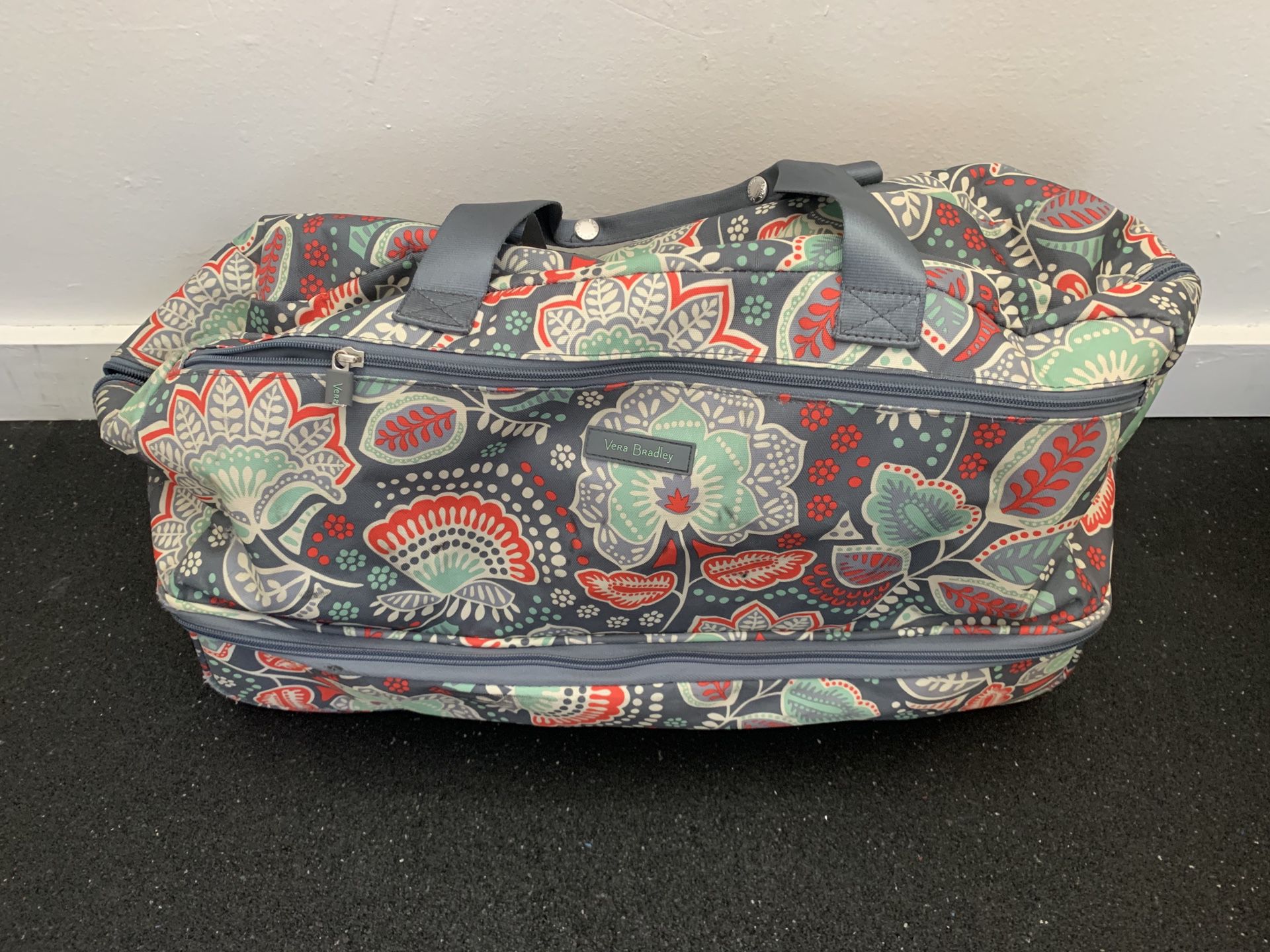 Vera Bradley rolling duffle bag and matching backpack.