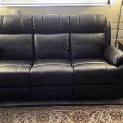 Excellent condition, Black leather reclining couch