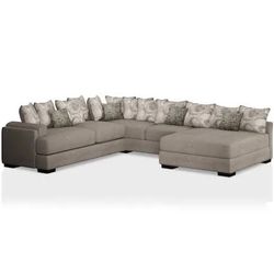 Novelia beige 2-piece sectional featuring a soft woven fabric and textured accent pillows