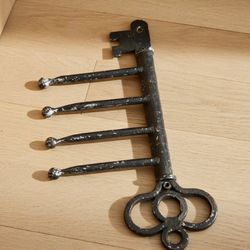 rustic black metal key-shaped wall hook rack