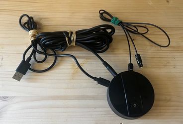 Bluetooth Audio Receiver with Cables : Bluetooth audio receiver or wireless adapter puck featuring a power button and a charge port, commonly used to
