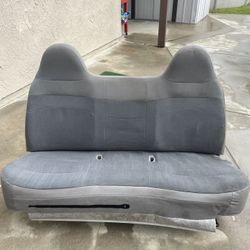 1999 Ford F-150 Gray Bench Seat. Good condition. Comes with full seat cover and console. 