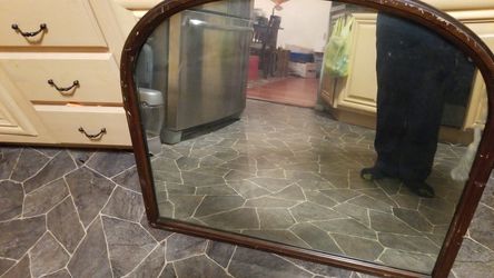 Vintage mirror 30" tall by 34 wide. Age unknown