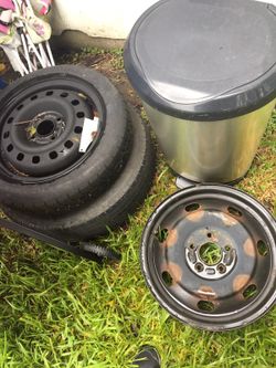 4 lug spare and 2 5 lug rims (steelies)