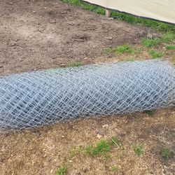 Three fifty foot rolls of chain link fence