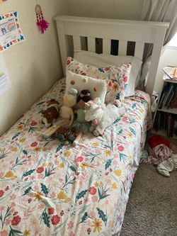 Twin size white bed. All wood construction