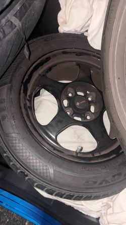 2 black rims and tires