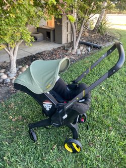 Doona X  Dessert Green stroller car seat combo