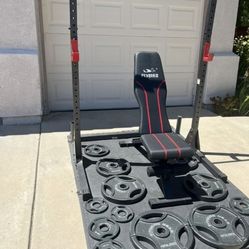 Very nice weight bench and squat rack. $300
Olympic weight plates sold separately. 

Lots Of Olympic Weights Available. 45s, 35s, 25s, 10s, 5s. $1 a p
