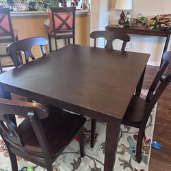 Dark wood dining table and chairs