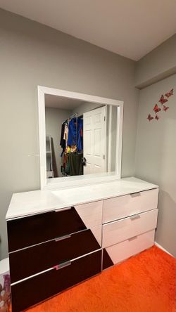 6 spacious drawers * Large matching mirror included * Modern black and white design * Good used condition * Smoke-free home * Pickup only