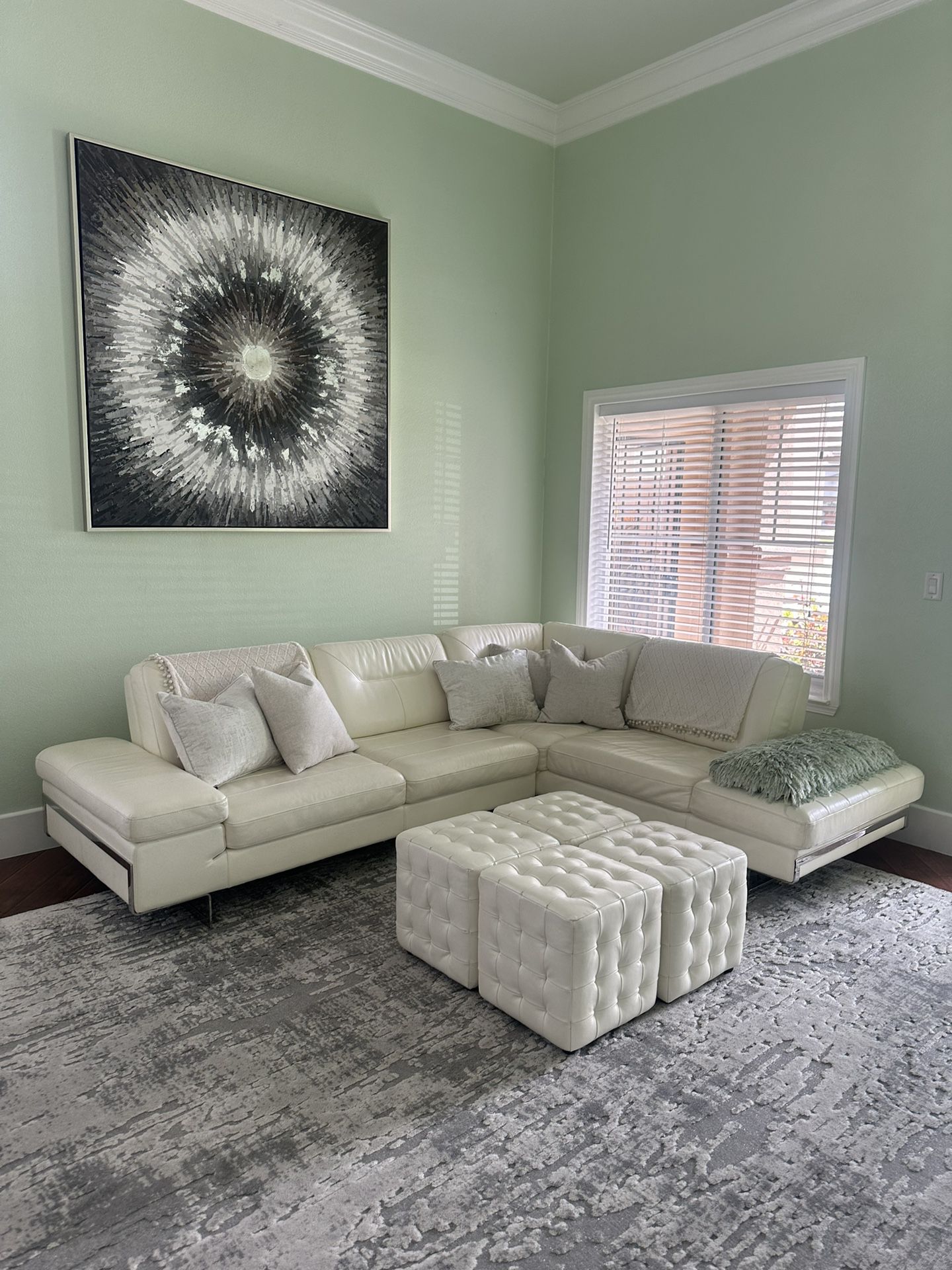 White leather couch with coverups and with cubes 