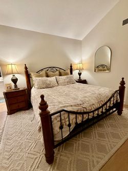 Ashley Wood and Wrought Iron bedroom set.