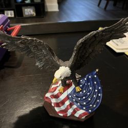 Eagle Perched On Flag