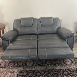 Costco Leather Power recliner loveseat, only 4 months old, nearly new, moving must sell.