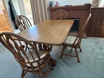 Dining room table with six chairs and extension leaf