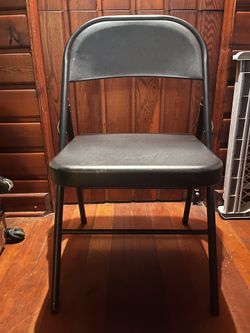 Pair of black folding cosco chairs
