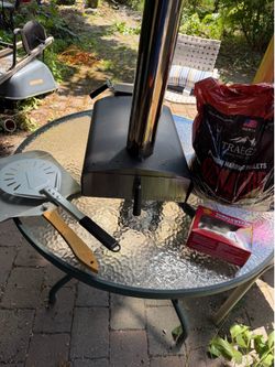 Pizza oven with supplies