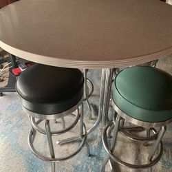 Table With Four Barstools 