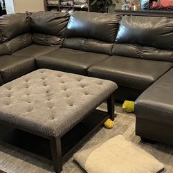 Leather Sectional, Ottoman And Area Rug