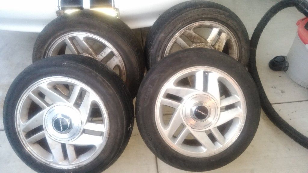 Set of Camaro rims and tires.