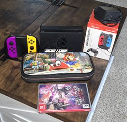 Nintendo Switch + 4 Joycon Controllers w/ 4 Controller Charging Station + Case + 2 Paid Games