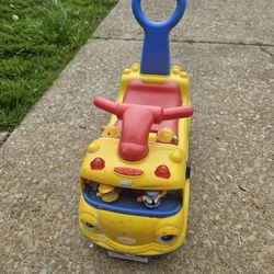 Fisher price little people car & can be pushed from behind in Great condition. 
It lights up and batteries are included.